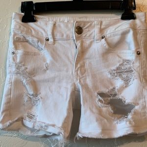 White ripped shorts